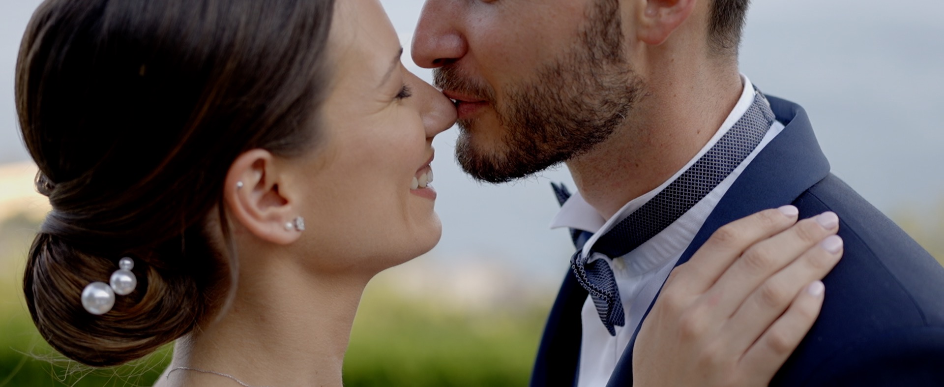 Close portrait of a bride and groom looking at each other