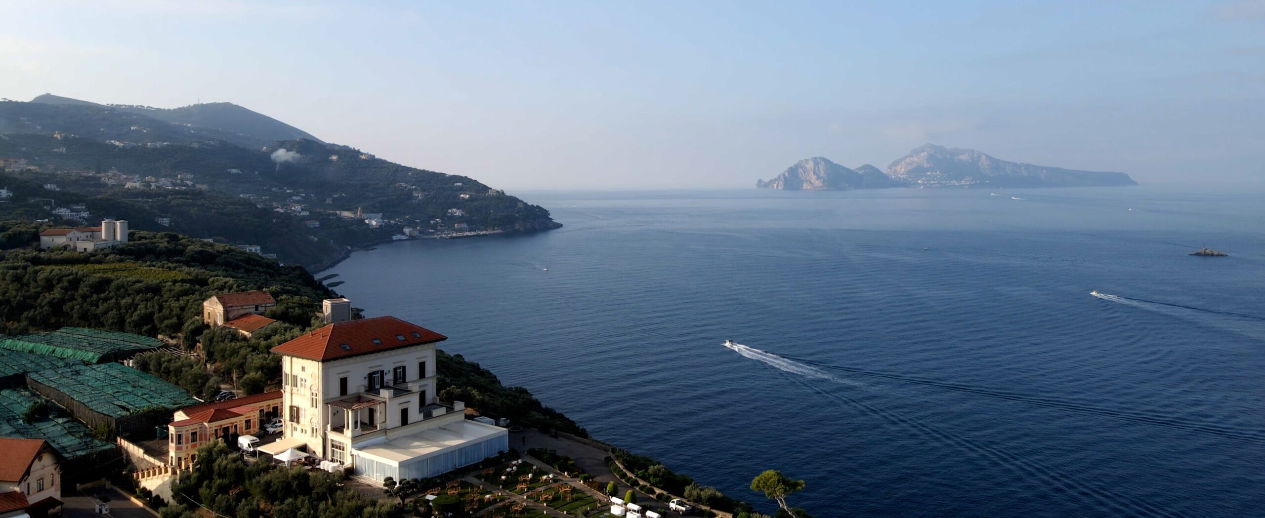 Italian coastal landscape with a villa overlooking the sea
