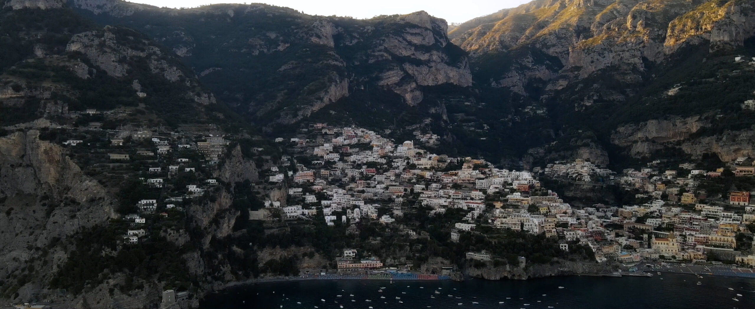 Coastal town rising between the mountains and the sea