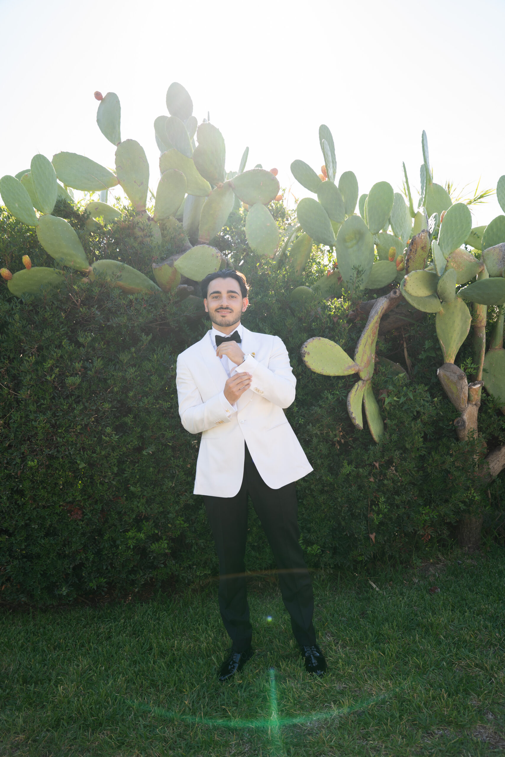 Jacob wearing a white dinner jacket on his wedding day