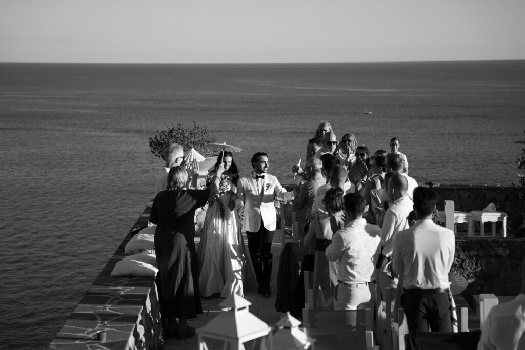 Jacob and Morane celebrating with friends beside the sea