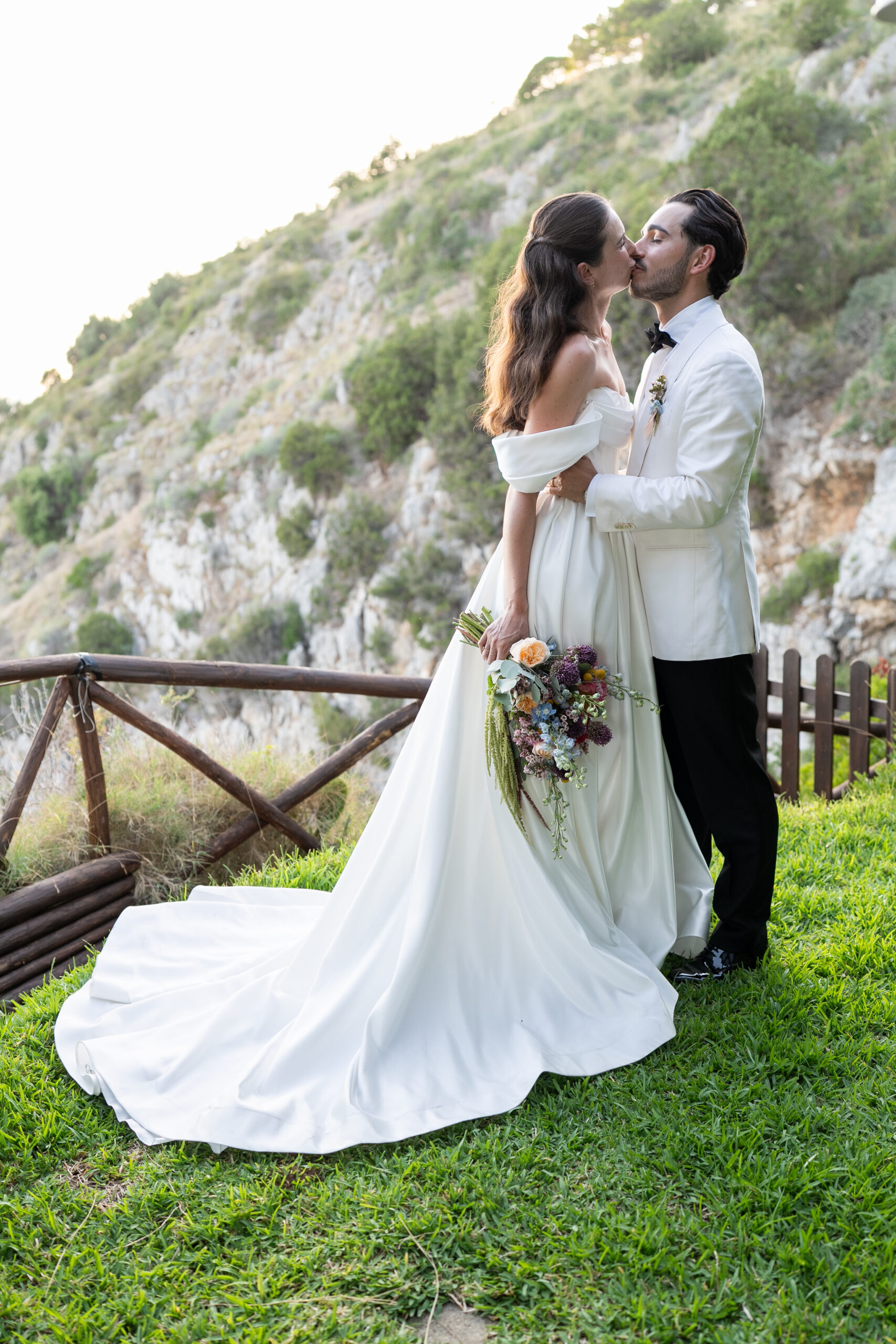 Jacob and Morane embracing beside the Palinuro coastline