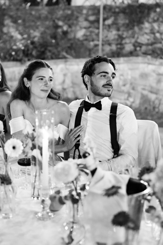 Jacob and Morane listening to a speech during their wedding dinner