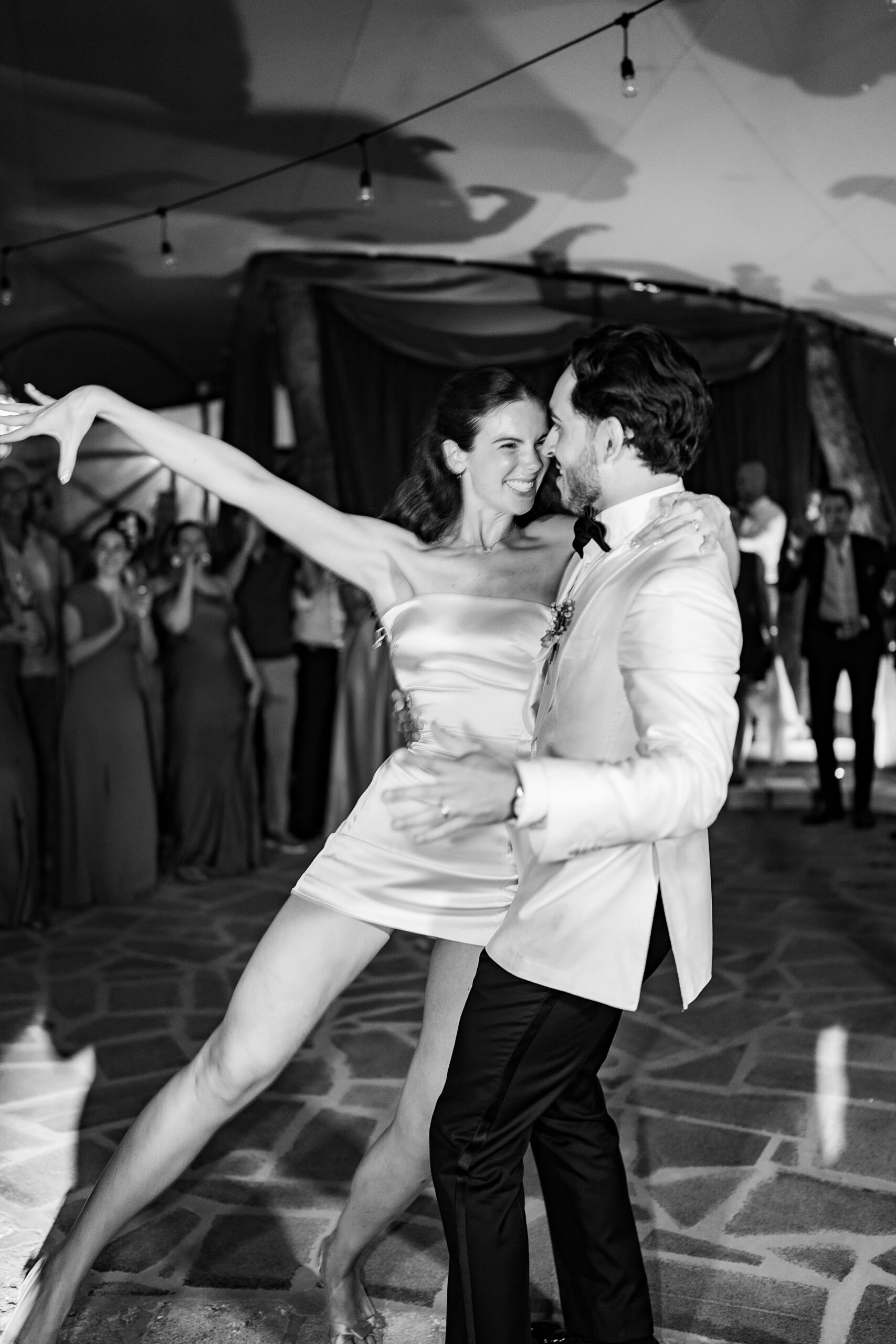 Candid black and white photograph of Jacob and Morane dancing