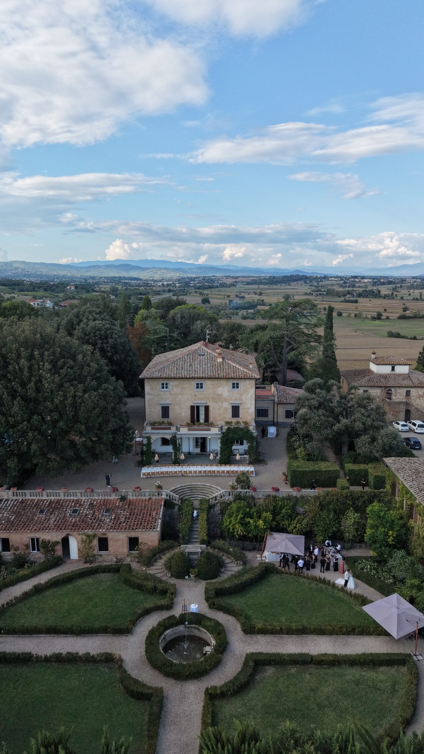 Aerial view of the historic buildings and countryside at Villa Fabbriche Palma in Tuscany.