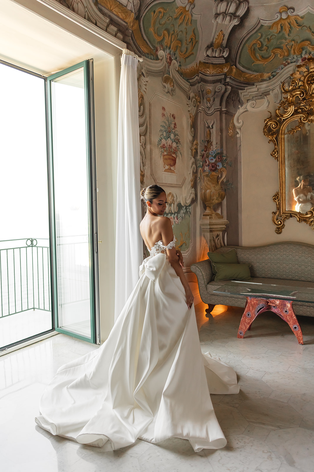 Zeenat in her wedding dress inside an ornate room at Bellevue Syrene