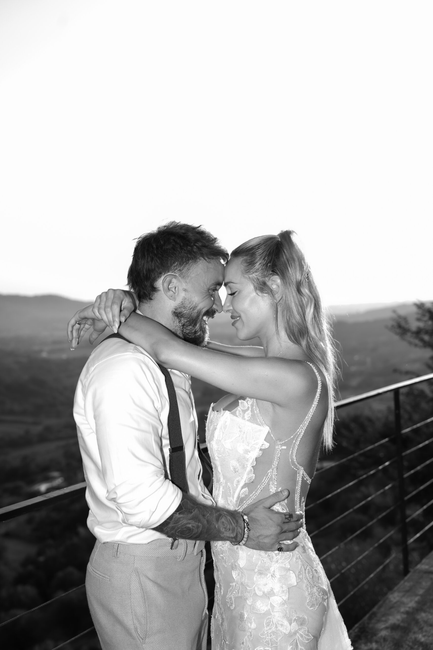 Black and white portrait of Adam and Polly embracing at Domus Laeta