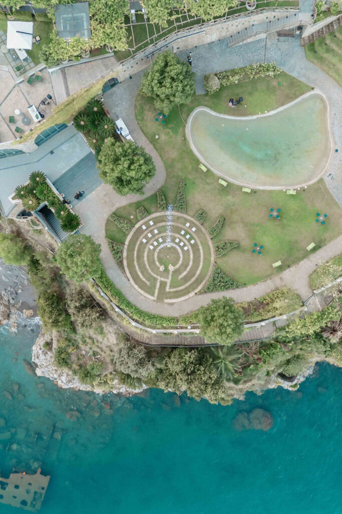 Aerial view of the circular gardens and coastline at Giardini del Fuenti