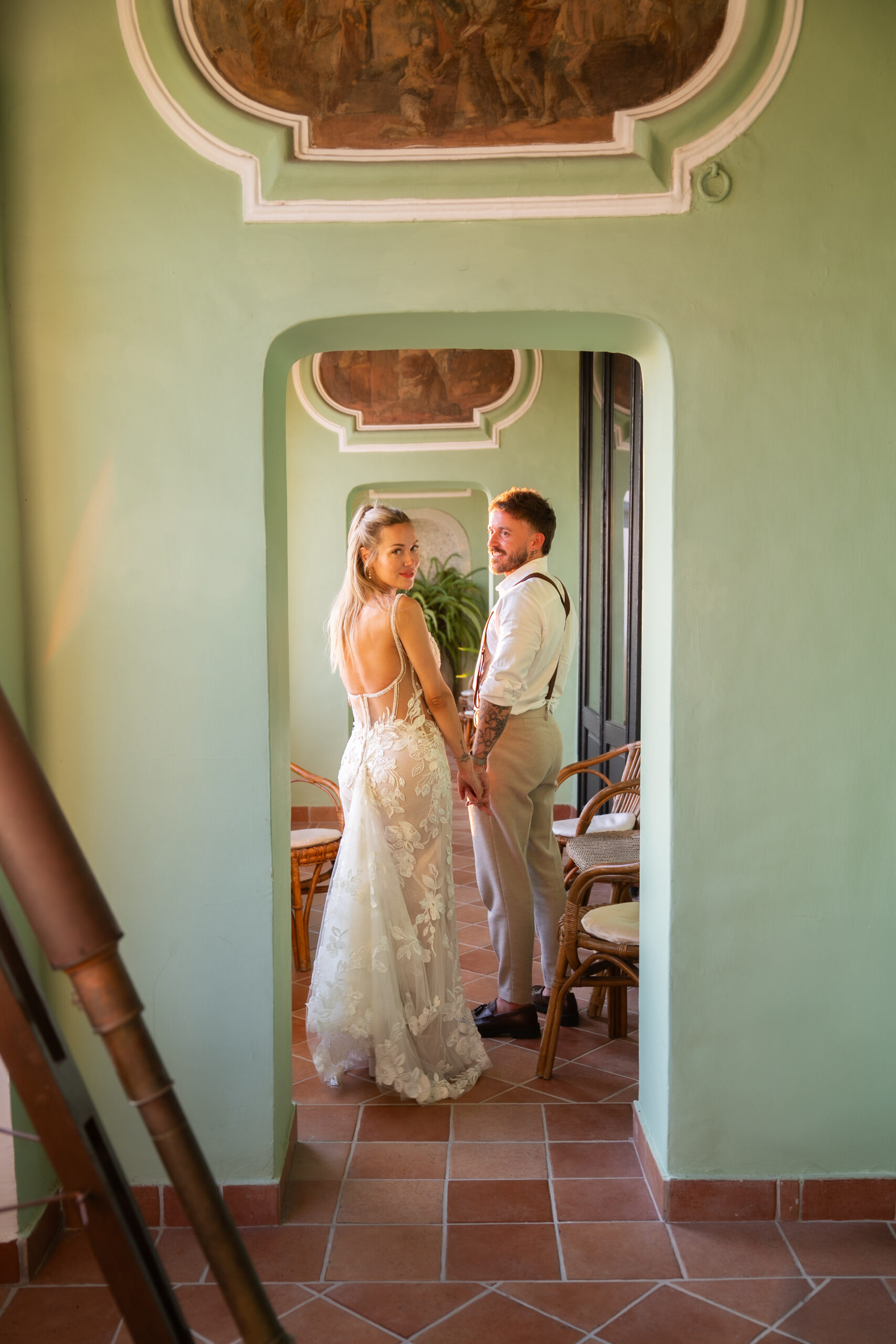 Adam and Polly framed by the historic interiors of Domus Laeta