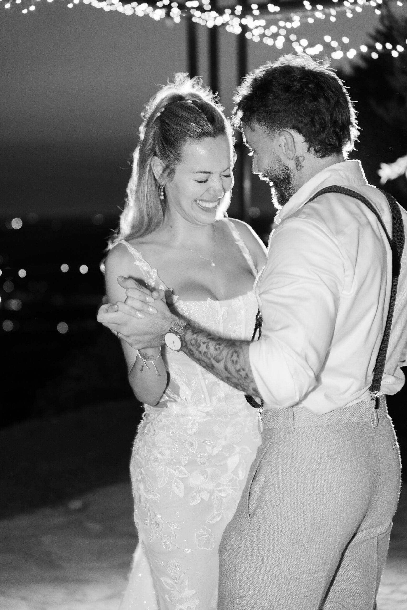 Adam and Polly laughing during their first dance