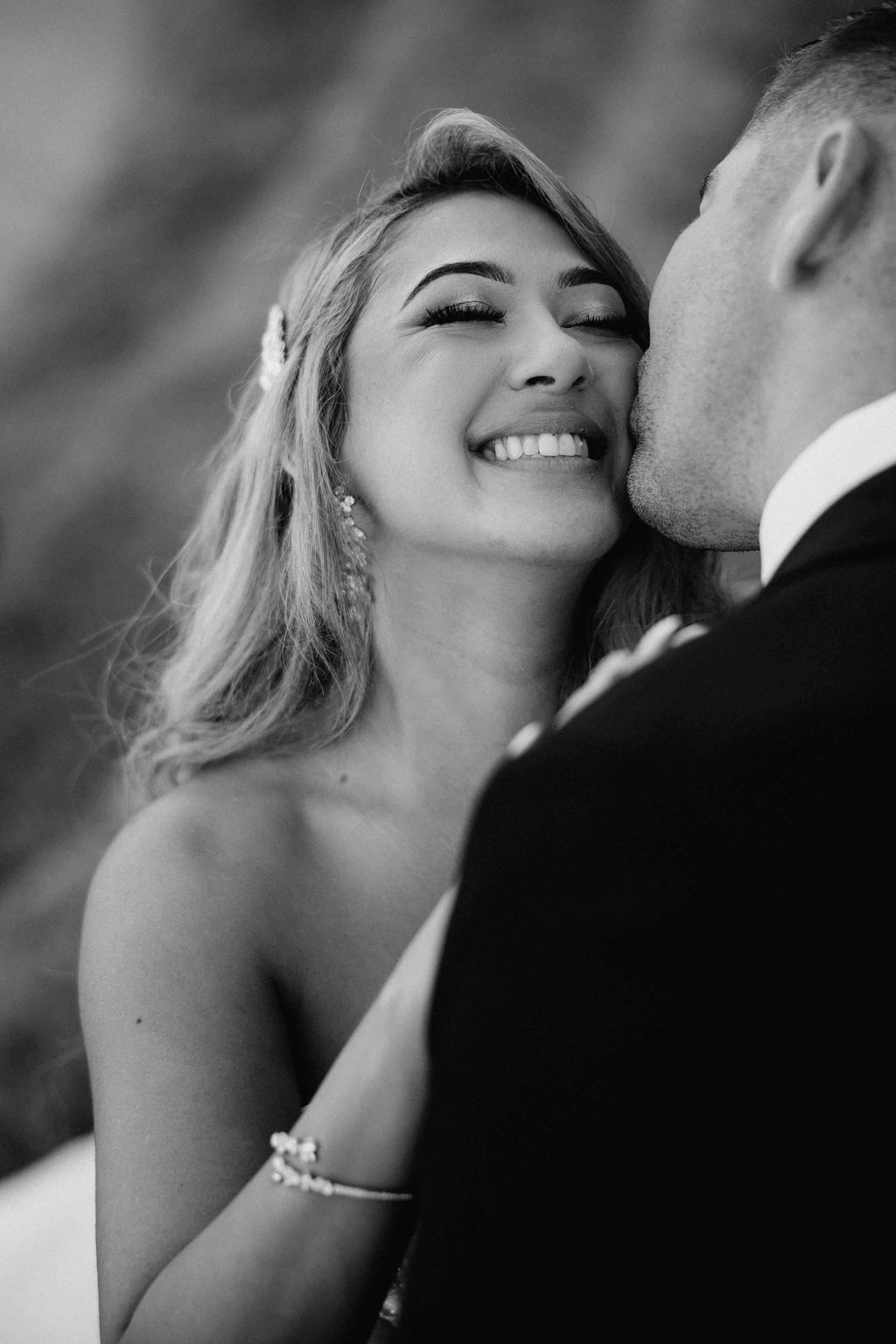 Bride smiling beside the groom during an intimate wedding moment