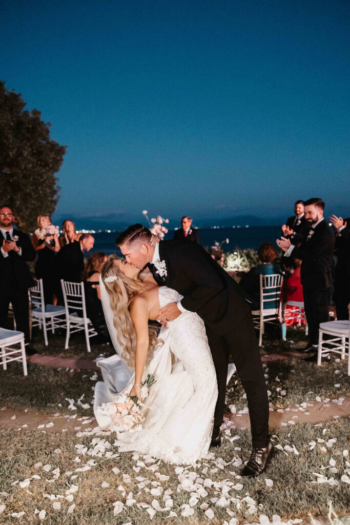 Bride and groom celebrating with guests at sunset on the Amalfi Coast