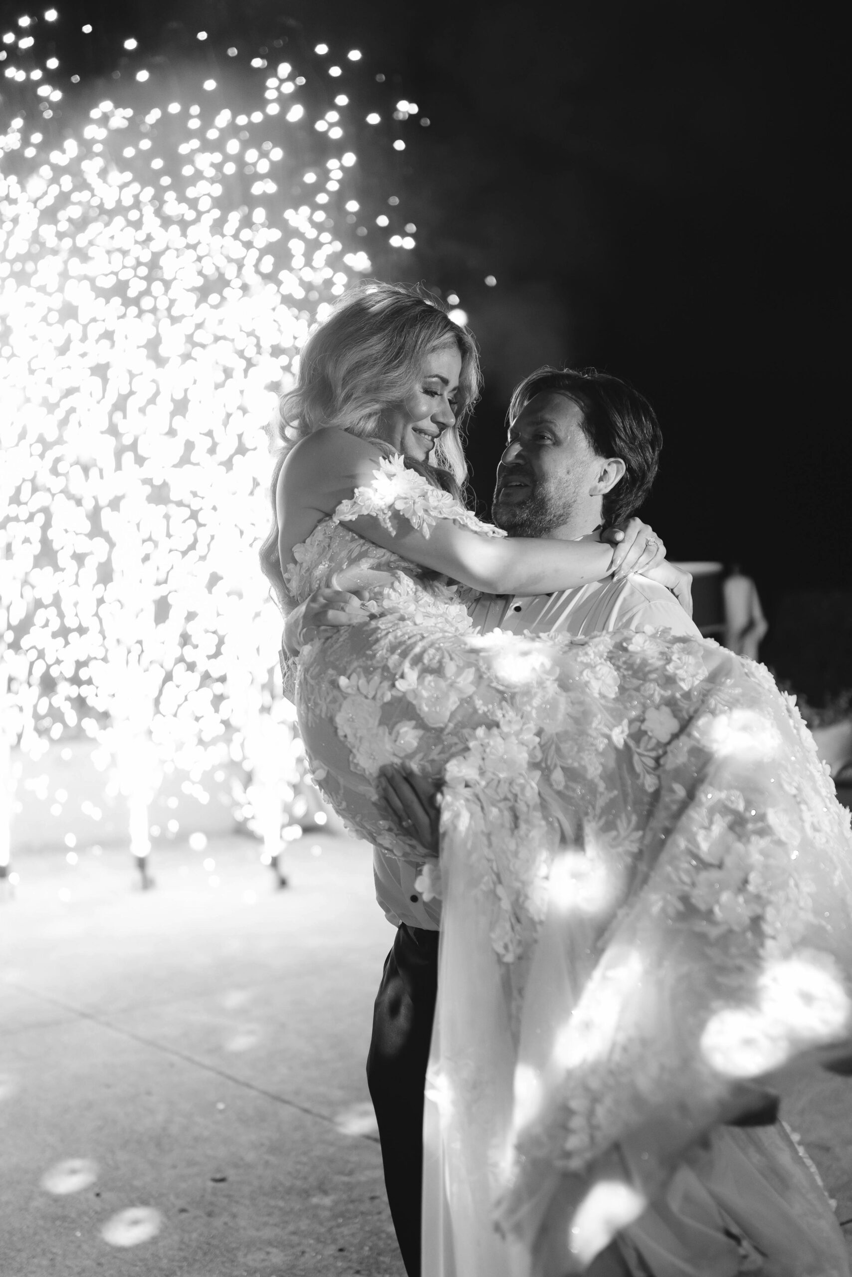 Candid black and white moment as Laura embraces a loved one before her wedding in Amalfi