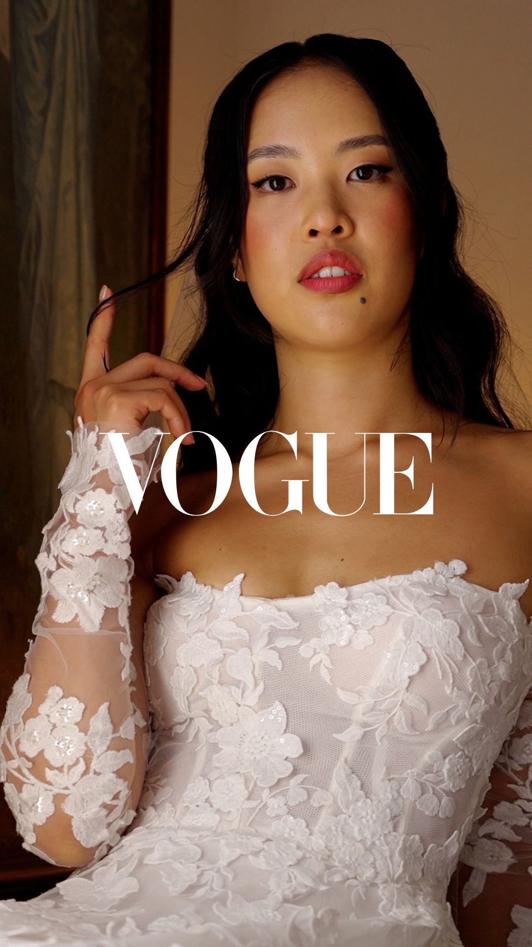 Portrait of Gaia in her lace wedding gown with a Vogue logo overlay.